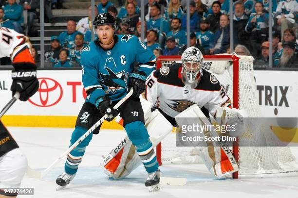 John Gibson of the Anaheim Ducks defends Joe Pavelski of the San Jose Sharks in Game Three of the Western Conference First Round during the 2018 NHL...