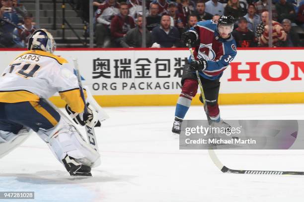 Carl Soderberg of the Colorado Avalanche takes a shot against goaltender Juuse Saros of the Nashville Predators in Game Three of the Western...