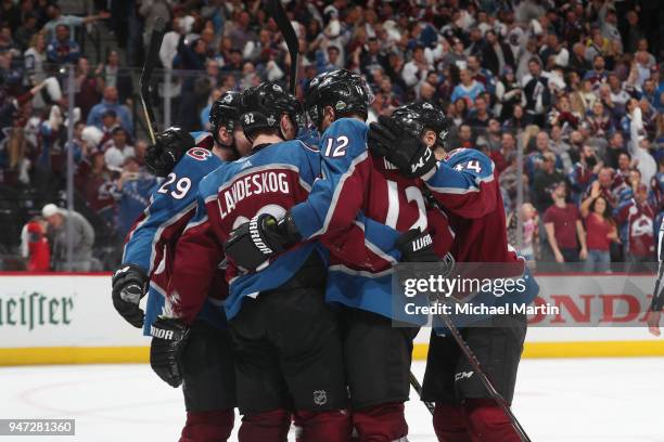 Gabriel Landeskog of the Colorado Avalanche celebrates a goal against the Nashville Predators with teammates Nathan MacKinnon, Patrik Nemeth and Mark...