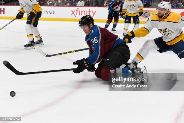 Colorado Avalanche right wing Mikko Rantanen gets after the puck against Nashville Predators center Nick Bonino in the third period during the third...