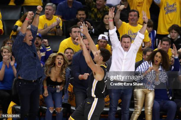 Klay Thompson of the Golden State Warriors reacts after he made a three-point basket against the San Antonio Spurs during Game 2 of Round 1 of the...