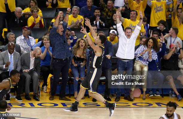 Klay Thompson of the Golden State Warriors reacts after he made a three-point basket against the San Antonio Spurs during Game 2 of Round 1 of the...