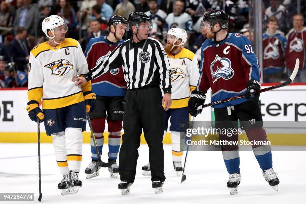 Gabriel Landeskog of the Colorado Rockies and Roman Josi of the Nashville Predators are separated by David Brisebois in Game Three of the Western...