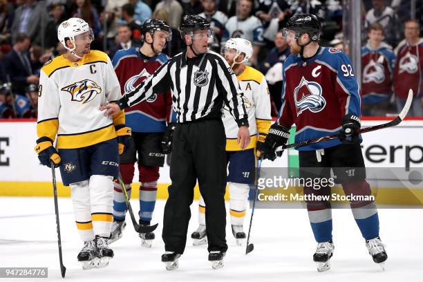 Gabriel Landeskog of the Colorado Rockies and Roman Josi of the Nashville Predators are separated by David Brisebois in Game Three of the Western...