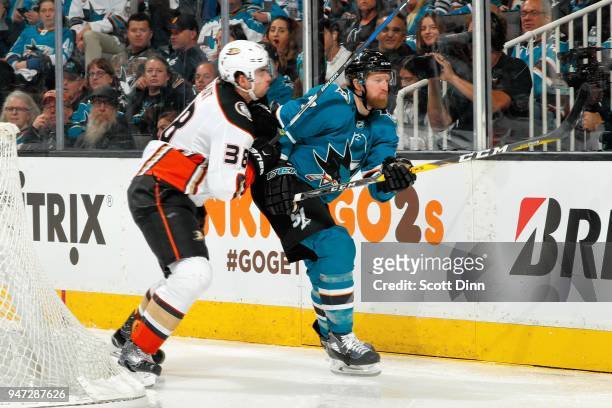 Derek Grant of the Anaheim Ducks checks Paul Martin of the San Jose Sharks in Game Three of the Western Conference First Round during the 2018 NHL...