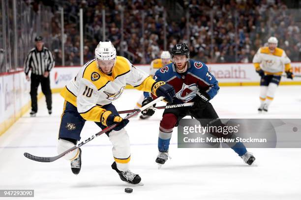 Colton Sissons of the Nashville Predators brings the puck down the ice against J.T. Compher of the Colorado Rockies in Game Three of the Western...