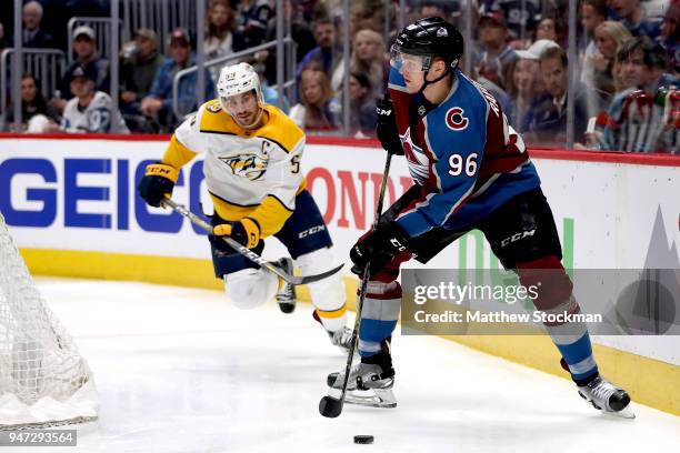 Mikko Rantanen of the Colorado Rockies looks for an opening on goal against Roman Josi of the Nashville Predators in Game Three of the Western...