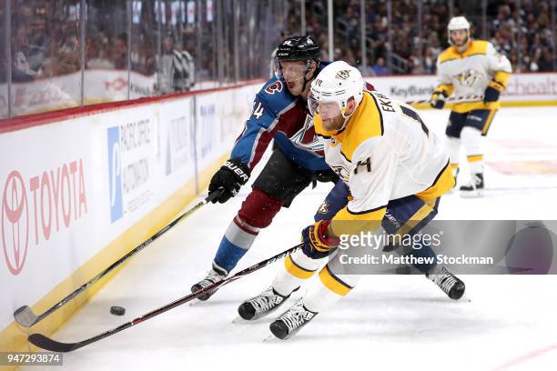 Carl Soderberg of the Colorado Rockies fights for control of the puck against Mattias Ekholm of the Nashville Predators in Game Three of the Western...