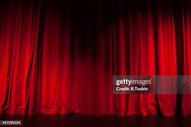 curtain from the theatre with a spotlight as background - cabaret fotografías e imágenes de stock