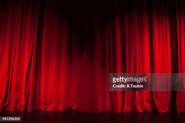 curtain from the theatre with a spotlight as background - actor photos ストックフォトと画像