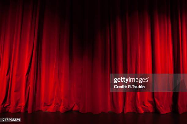 curtain from the theatre with a spotlight as background - theatrical performance imagens e fotografias de stock