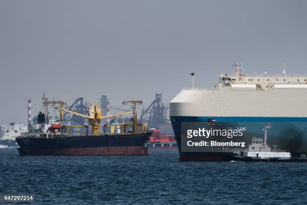 Ships sail through a port in Yokohama, Japan, on Monday, April 16, 2018. Japan and China held their first high-level economic dialogue in almost...