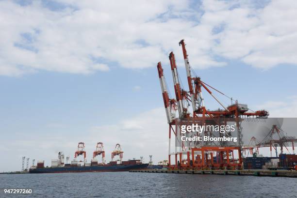 Gantry cranes stand at a shipping terminal in Yokohama, Japan, on Monday, April 16, 2018. Japan and China held their first high-level economic...
