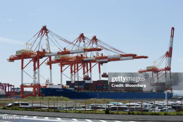 Container ship is berthed at a shipping terminal in Yokohama, Japan, on Monday, April 16, 2018. Japan and China held their first high-level economic...