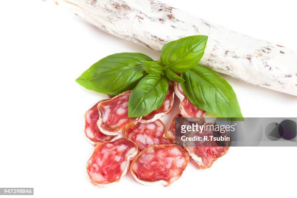 salami sliced on the white background - embutido stock-fotos und bilder