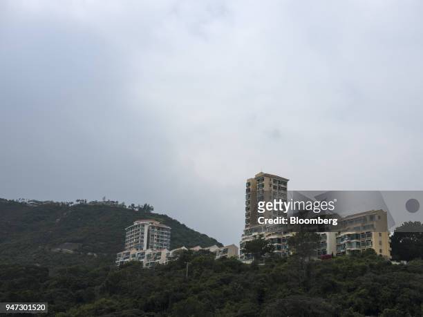 Apartment buildings stand in Discovery Bay, a residential project developed by Hong Kong Resort Co., on Lantau Island in Hong Kong, China, on...
