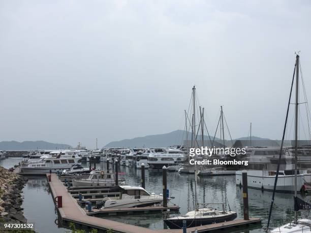 Yachts are moored at a marina in Discovery Bay, a residential project developed by Hong Kong Resort Co., on Lantau Island in Hong Kong, China, on...