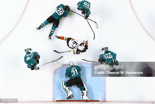 Goalie Martin Jones, Justin Braun, Mikkel Boedker, Logan Couture and Marc-Edouard Vlasic of the San Jose Sharks defends the goal against Rickard...