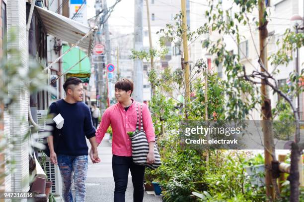 couple walking outside - chubby man shopping stock pictures, royalty-free photos & images