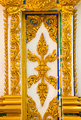 Ancient golden carving wooden window of Loas temple. Pakse Loas.