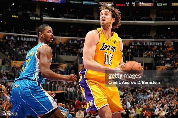 Pau Gasol of the Los Angeles Lakers spins around Hilton Armstrong of the New Orleans Hornets during the game on December 1, 2009 at Staples Center in...