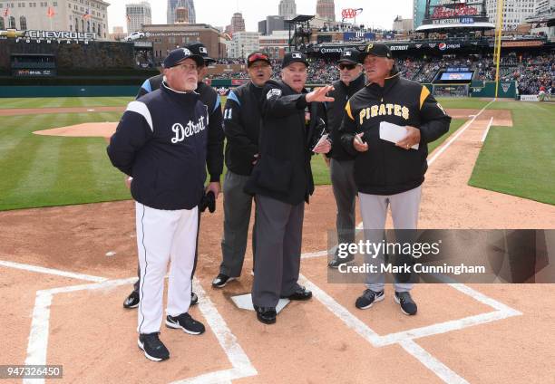 Manager Ron Gardenhire of the Detroit Tigers and manager Clint Hurdle of the Pittsburgh Pirates get instructions from the umpire crew prior to the...