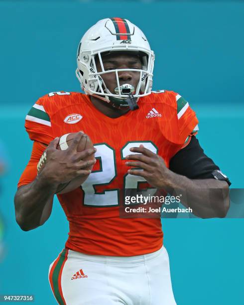 Robert Burns of the Miami Hurricanes runs with the ball prior to the spring game on April 14, 2018 at Hard Rock Stadium in Miami Gardens, Florida....