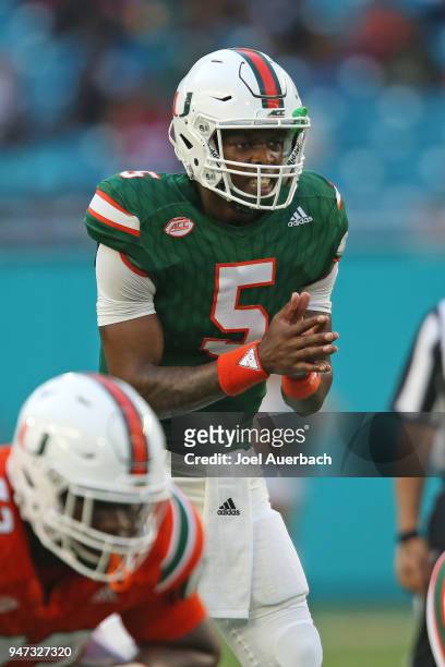 Kosi Perry of the Miami Hurricanes prepares to take the snap of the ball during the spring game on April 14, 2018 at Hard Rock Stadium in Miami...