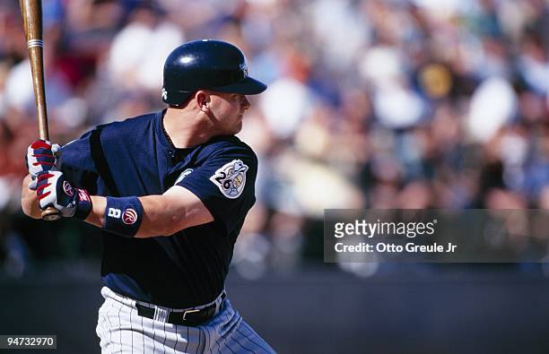 Todd Greene of the Anaheim Angels bats against the Oakland Athletics during their spring training game at Phoenix Municipal Stadium on March 6, 1999...
