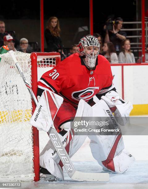 Cam Ward of the Carolina Hurricanes crouches in the crease to protect the net during an NHL game against the Tampa Bay Lightning on April 7, 2018 at...