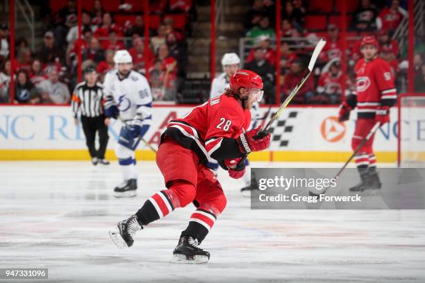 Elias Lindholm of the Carolina Hurricanes skates for position on the ice during an NHL game against the Tampa Bay Lightning on April 7, 2018 at PNC...