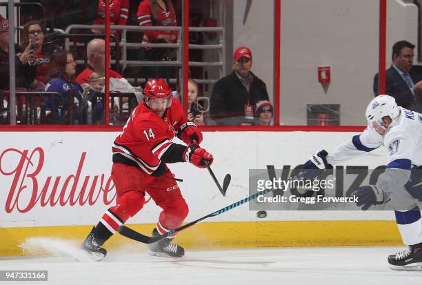 Justin Williams of the Carolina Hurricanes passes the puck passed the defense of Alex Killorn of the Tampa Bay Lightning during an NHL game on April...