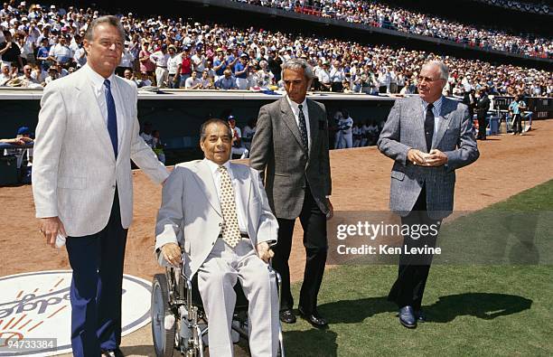 Don Drysdale, Roy Campanella, Sandy Koufax and Duke Snider are shown on the field before a Los Angeles Dodgers game in the 1990 season at Dodger...