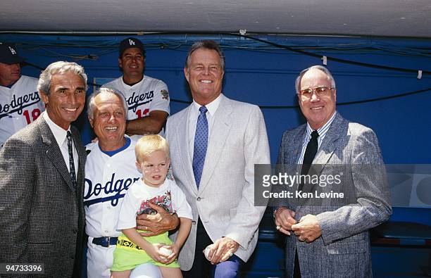 Sandy Koufax, Tommy Lasorda, Don Drysdale and Duke Snider pose for a photo before a Los Angeles Dodgers game in the 1990 season at Dodger Stadium in...
