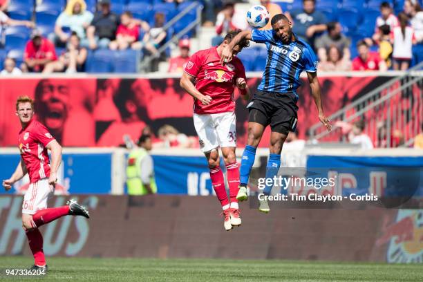 Anthony Jackson-Hamel of Montreal Impact challenged by Aaron Long of New York Red Bulls during the New York Red Bulls Vs Montreal Impact MLS regular...