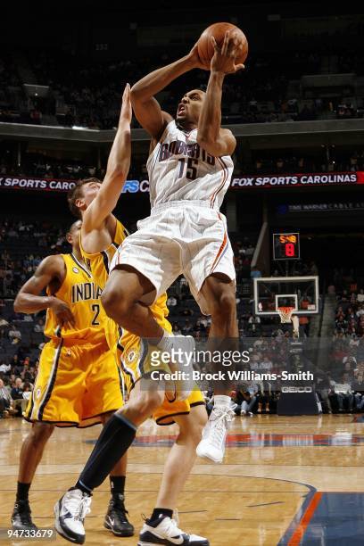 Gerald Henderson of the Charlotte Bobcats goes up for a shot against Tyler Hansbrough of the Indiana Pacers during the game at Time Warner Cable...