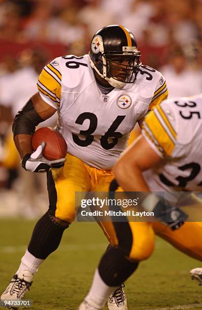 Jerome Bettis of the Pittsburgh Steelers runs with the ball during a NFL pre season football game against the Washington Redskins on August 18, 2002...