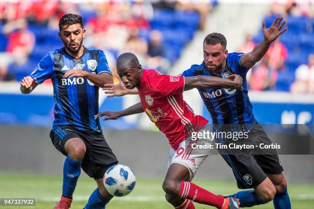 Bradley Wright-Phillips of New York Red Bulls challenged by Rudy Camacho of Montreal Impact during the New York Red Bulls Vs Montreal Impact MLS...