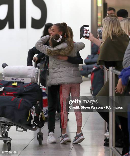 Georgia-Mae Fenton with sister Lili-Ella Fenton during the England Team Homecoming at Heathrow Airport, London.