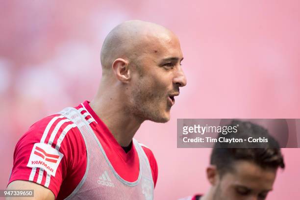Aurelien Collin of New York Red Bulls celebrates a goal while warming up as a substitute during the New York Red Bulls Vs Montreal Impact MLS regular...