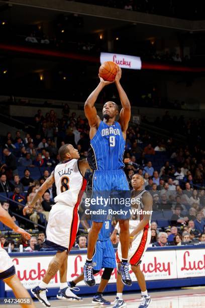 Rashard Lewis of the Orlando Magic shoots a jump shot against Monta Ellis of the Golden State Warriors during the game at Oracle Arena on December 5,...