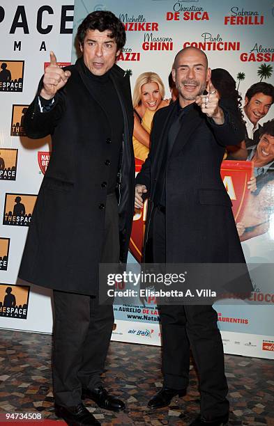 Actors Alessandro Gassman and Gianmarco Tognazzi attend the premiere of ''Natale A Beverly Hills'' at the Warner Moderno Cinema on December 17, 2009...