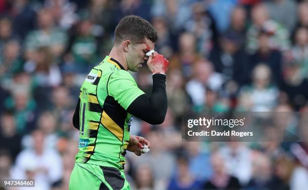 George North of Northampton leaves the field after cutting his face during the Aviva Premiership match between Leicester Tigers and Northampton...