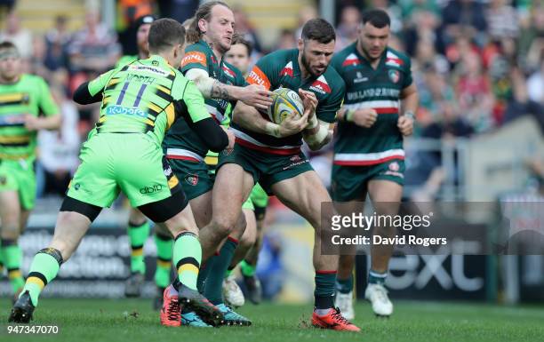 Adam Thompstone of Leicester is tackled during the Aviva Premiership match between Leicester Tigers and Northampton Saints at Welford Road on April...