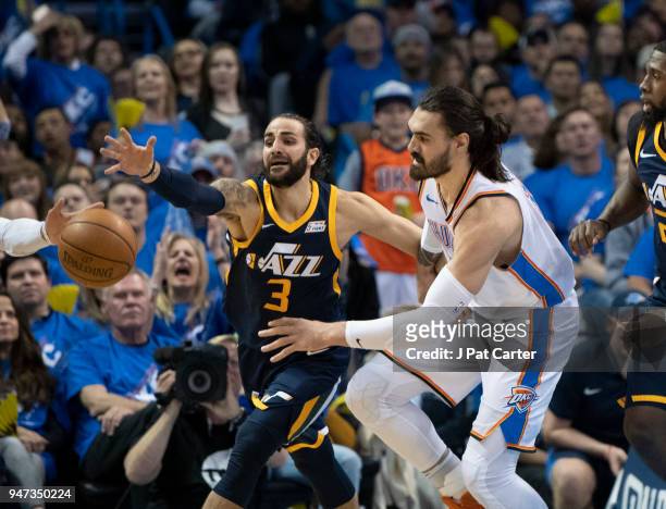 Ricky Rubio of the Utah Jazz and Steven Adams of the Oklahoma City Thunder battle for the ball during the first half of a NBA playoff game at the...