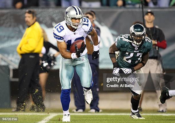 Miles Austin of the Dallas Cowboys scores on a 49-yard touchdown reception in the fourth quarter against Quintin Mikell of the Philadelphia Eagles at...