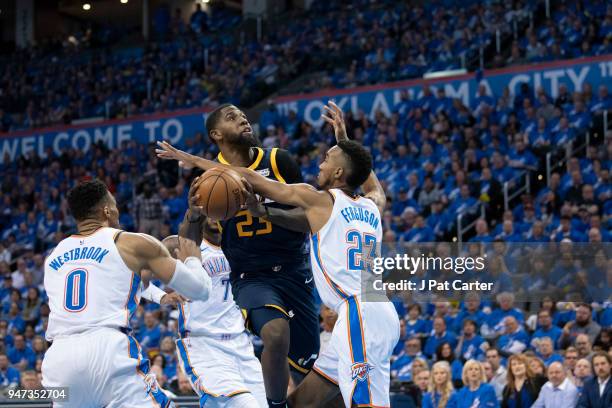 Royce O'Neale of the Utah Jazz tries to shoot over Terrance Ferguson of the Oklahoma City Thunder during the first half of a NBA playoff game at the...