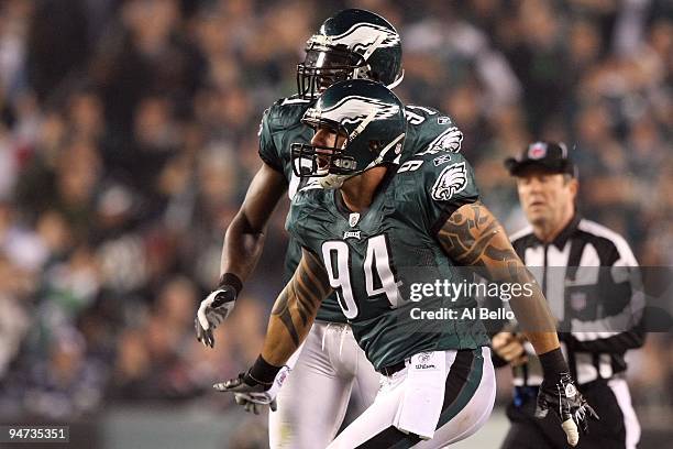 Jason Babin and Chris Clemons of the Philadelphia Eagles celebrate after Babin sacked quarterback Tony Romo of the Dallas Cowboys in the second...