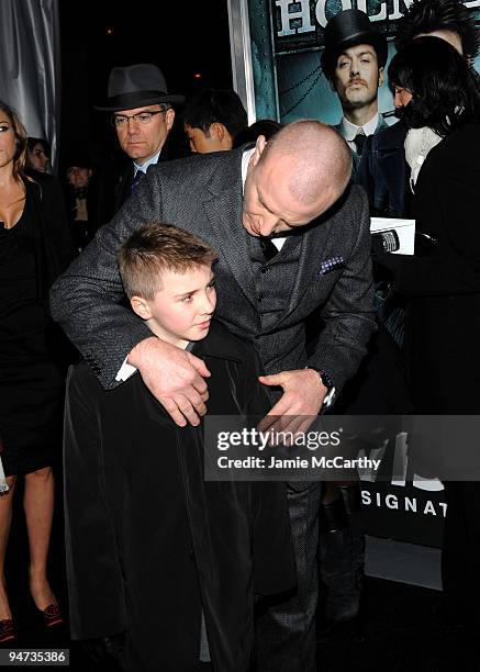 Director Guy Ritchie and Rocco Ritchie attend the New York premiere of "Sherlock Holmes" at the Alice Tully Hall, Lincoln Center on December 17, 2009...