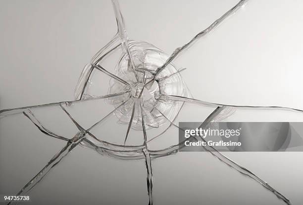 broken glass after bullet shot - windscreen stockfoto's en -beelden